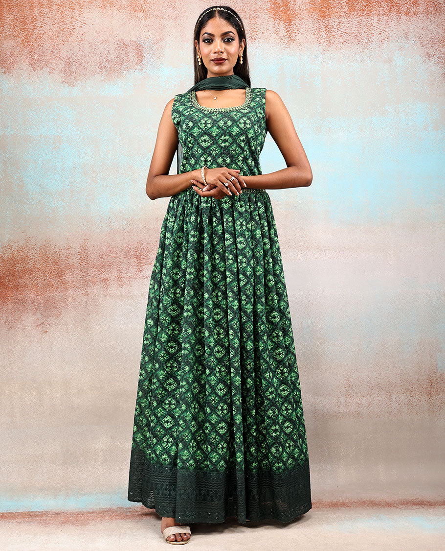Green printed georgette Anarkali features intricate motifs, mirror work neck & thread embroidered border & dupatta  