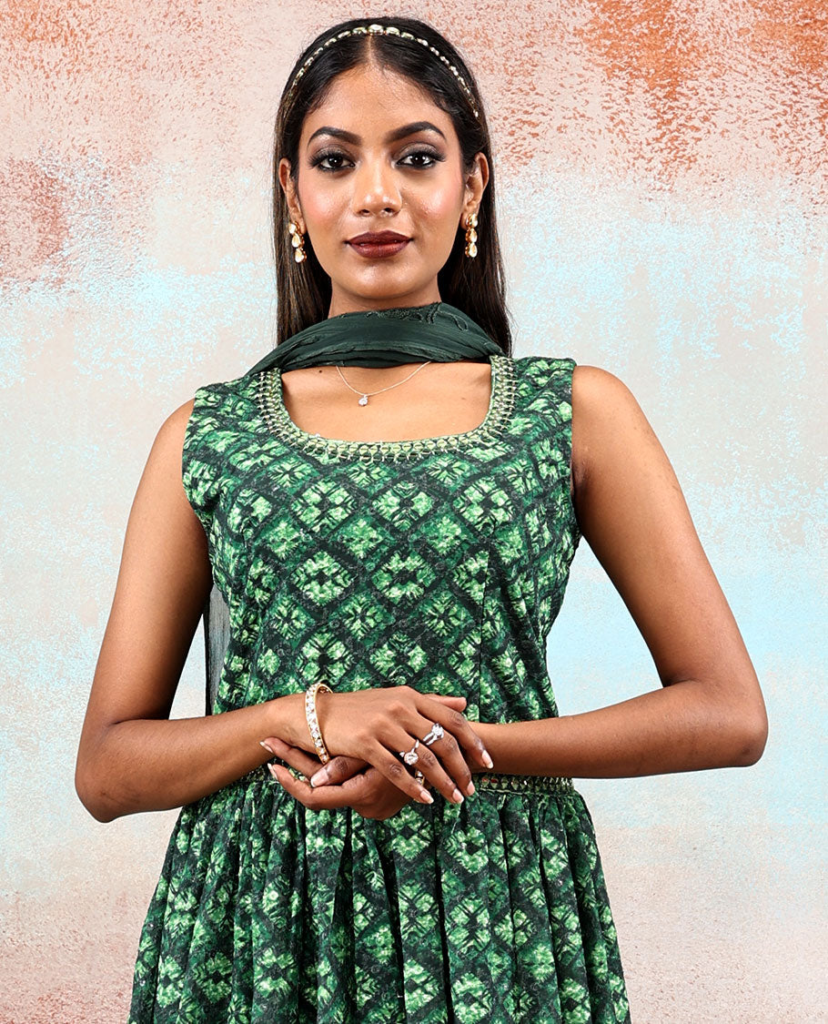 Green printed georgette Anarkali features intricate motifs, mirror work neck & thread embroidered border & dupatta  