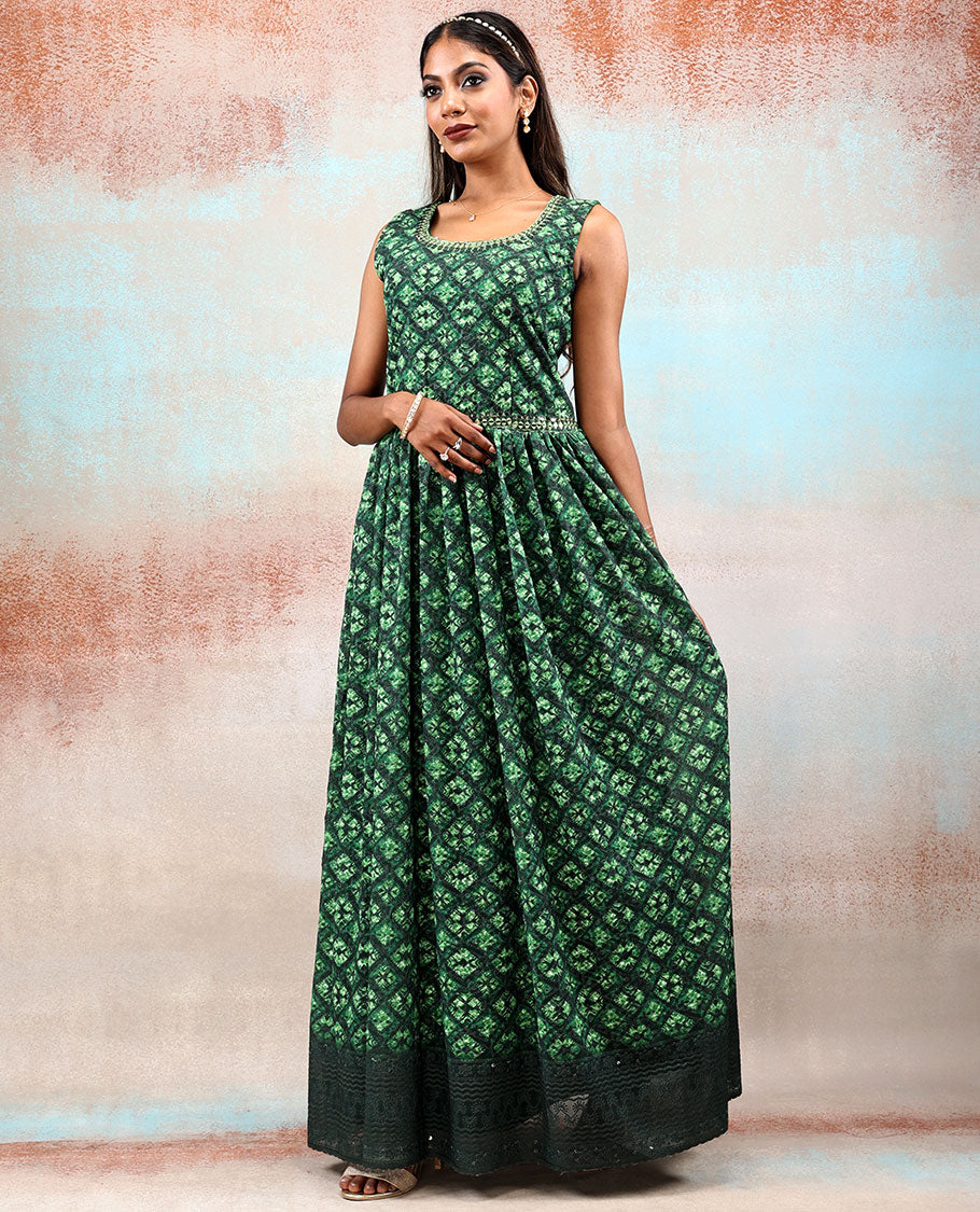 Green printed georgette Anarkali features intricate motifs, mirror work neck & thread embroidered border & dupatta  