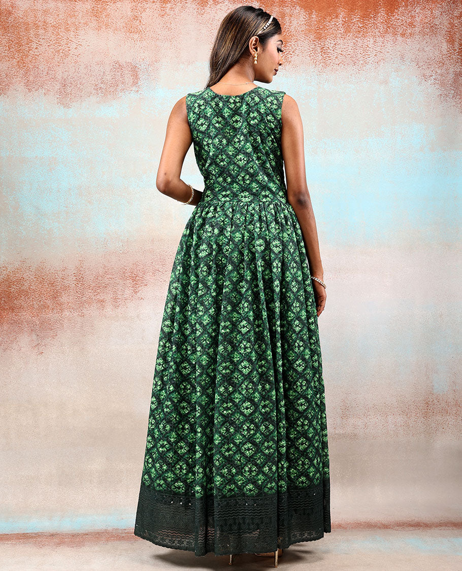 Green printed georgette Anarkali features intricate motifs, mirror work neck & thread embroidered border & dupatta  