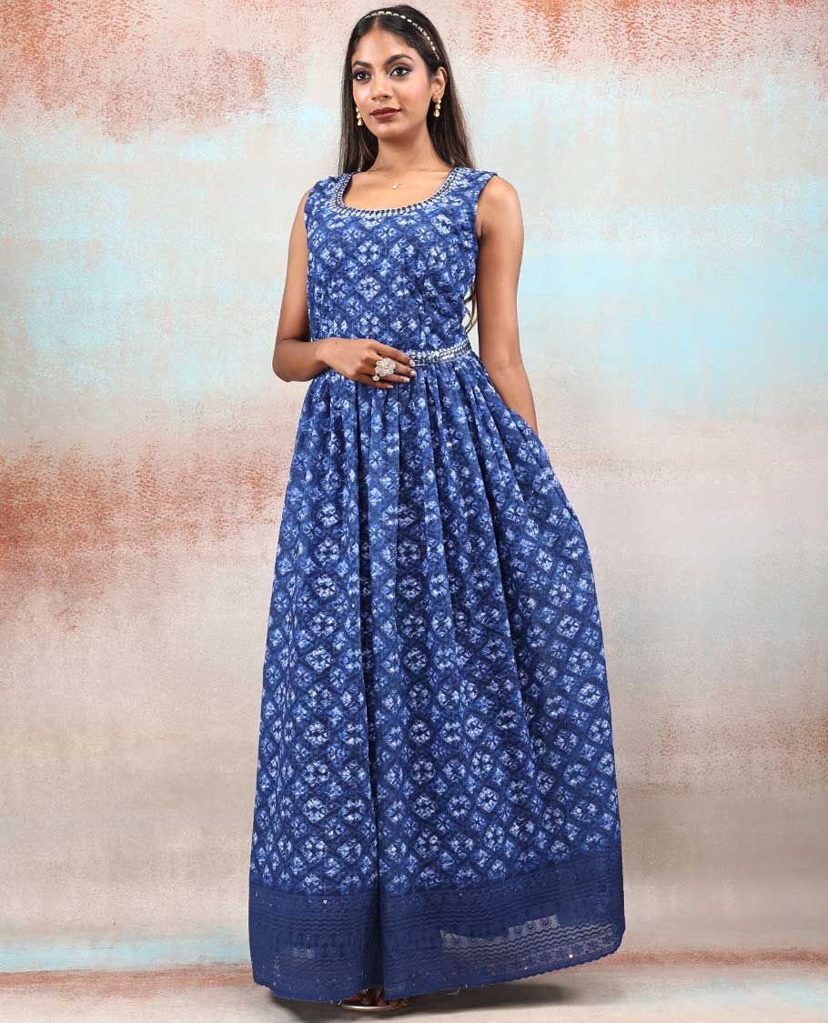 Blue printed georgette Anarkali features intricate motifs, mirror work neck & thread embroidered border & dupatta