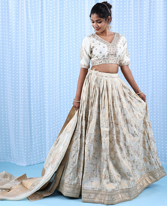 Buttercream raw silk readymade lehenga,thread & stone embroidered crop top, floral jaal banaras skirt & banaras dupatta 