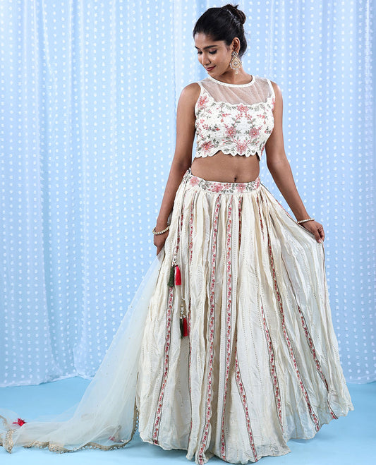 Cream Raw Silk Readymade lehenga features floral vine embroidered skirt,scallop & boat net necked crop top & net dupatta