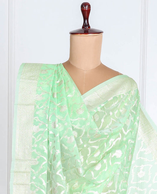 Lite pistachio green Banaras-style organza dupatta features floral jaal designs with tassels