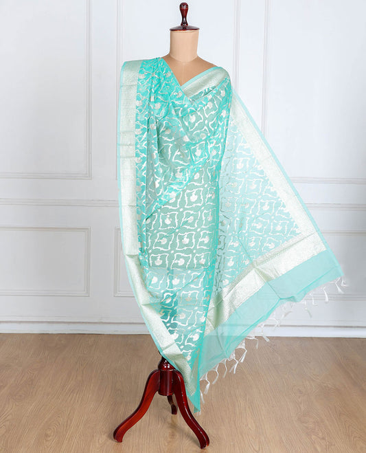 Lite turquoise Banaras-style organza dupatta features floral jaal designs with tassels