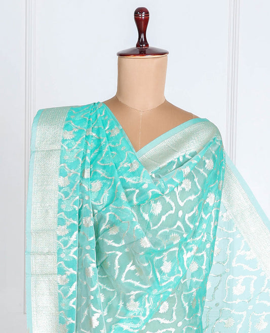 Lite turquoise Banaras-style organza dupatta features floral jaal designs with tassels