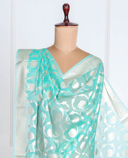 Pastel blue Banaras-style organza dupatta features floral jaal designs with tassels