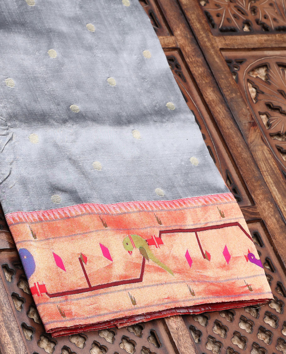 Grey paithani silksaree with buttas, contrast muniya border & pallu features floral vine, swans, peacock & parrots 