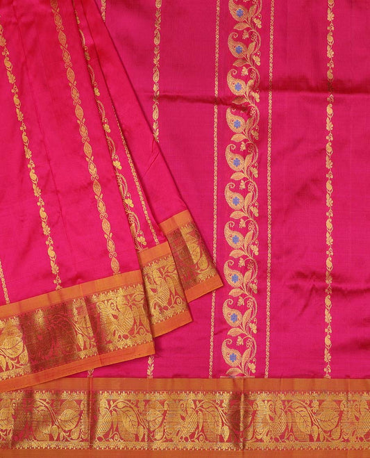 Pink navarathna pavadai with zari paisley designs, contrast border & blouse of intricate zari designs
