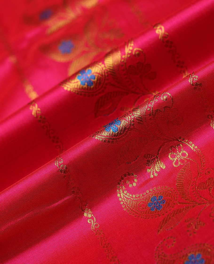 Pink navarathna pavadai with zari paisley designs, contrast border & blouse of intricate zari designs