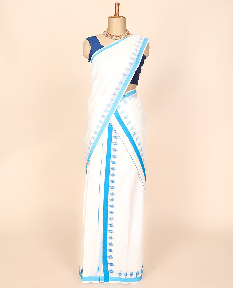 Cream printed kerala mundu set features peacock feathers & contrast blue border