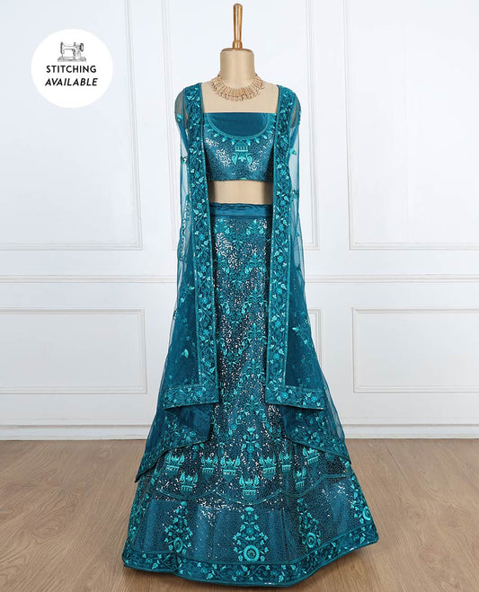 Dark teal blue lehenga set features intricate sequins & thread embroidered net skirt, top & patch border net dupatta