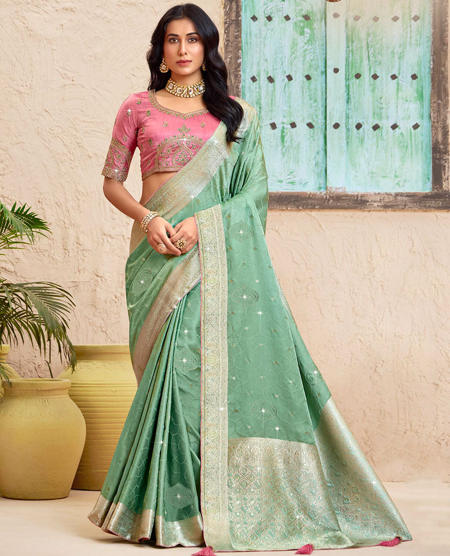 Green ogee pattern dola silk saree, zari stone work border, intricately woven stonework pallu & contrast embroidered blouse