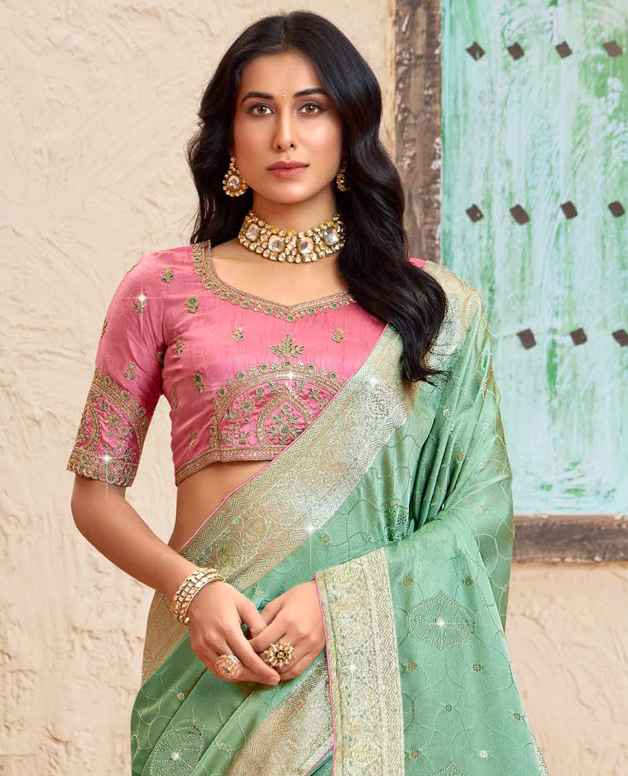Green ogee pattern dola silk saree, zari stone work border, intricately woven stonework pallu & contrast embroidered blouse
