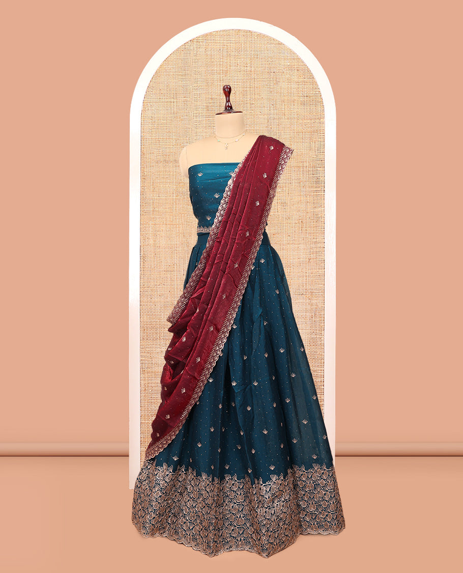 Peacock Blue Banarasi Half-Saree, Impeccably Styled with Embroidered Skirt, a Floral Embroidered Border, a Matching Blouse, and Contrast Scallop Embroidered Dupatta