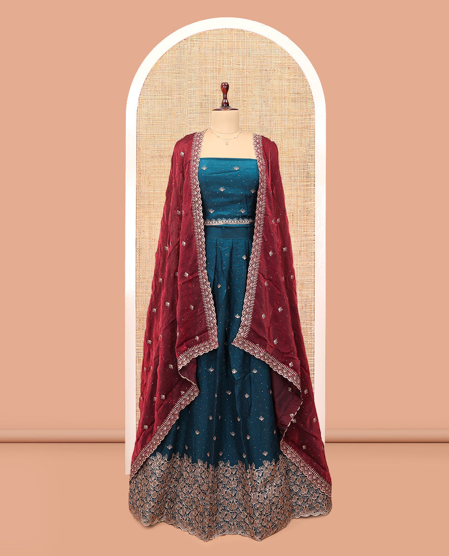 Peacock Blue Banarasi Half-Saree, Impeccably Styled with Embroidered Skirt, a Floral Embroidered Border, a Matching Blouse, and Contrast Scallop Embroidered Dupatta