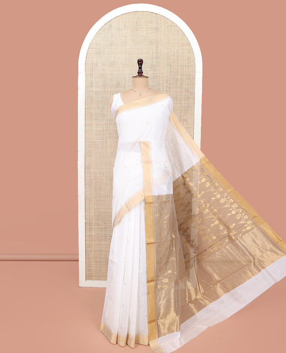 Cream Chanderi Cotton Saree, Graced with Buttas All Over Its Body, Highlighted by a Bavanji Border, Captivating Contrast Pallu of Floral Jaal Designs, and Paired with a Contrast Blouse