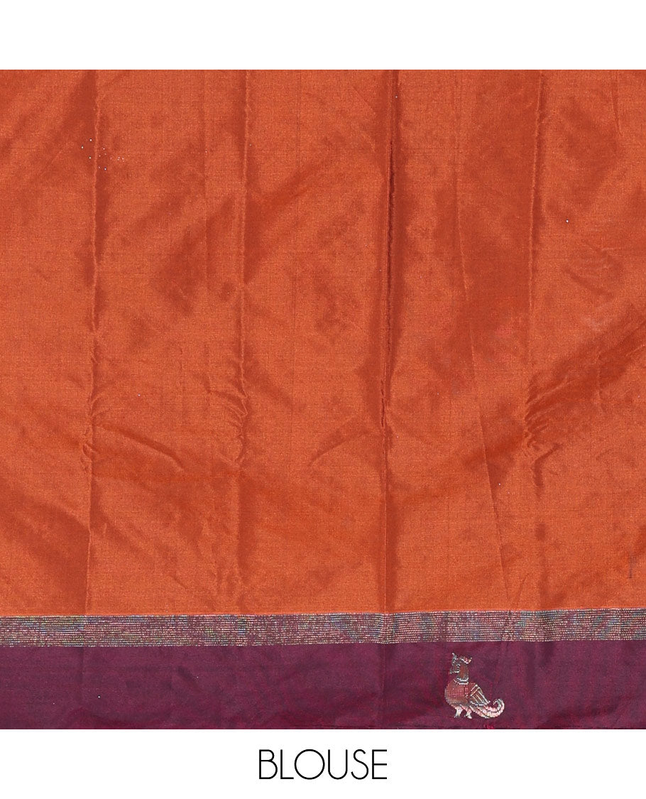 Rust orange dobby-style zari buttas semi-soft silk saree, contrast peacock zari border, zari design pallu, and a plain blouse