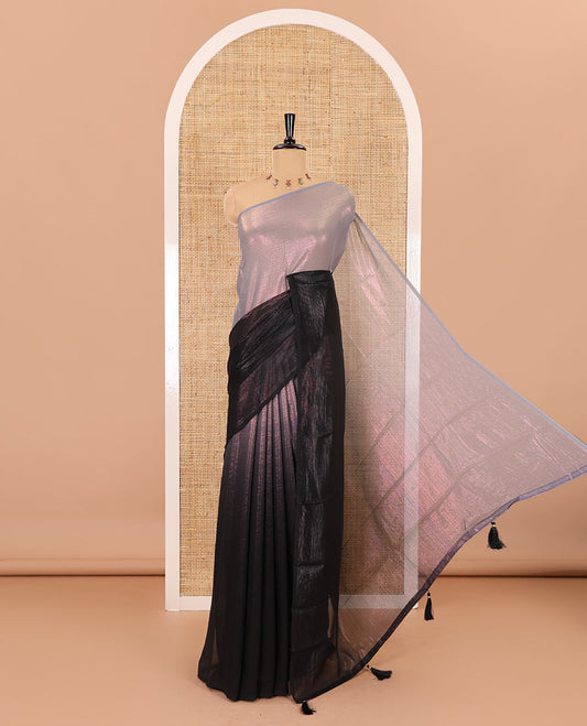 Borderless black ombre-toned gleaming Shimmer Georgette saree, self-pallu with tassels and a plain brown blouse