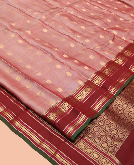 Pink Vasundhara Lite Silk Mix Saree, Decked Up with Mayil-Chakram Buttas, a Contrast Traditional Rettai Pettu Border, Pallu of Mayil-Yaanai Butta Enclosed Checks, and a Contrast Blouse