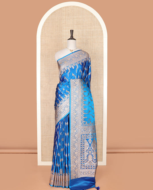 Blue floral buttas banarasi silk saree, traditional zari border of floral creeper designs, and pallu of intricate designs