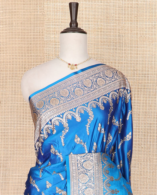 Blue floral buttas banarasi silk saree, traditional zari border of floral creeper designs, and pallu of intricate designs
