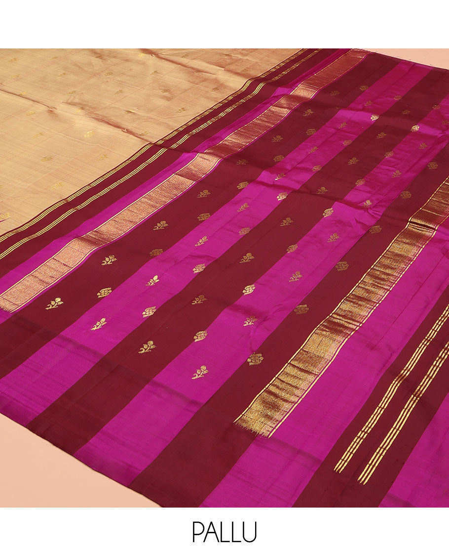 Sandal Kanchipuram Silk Saree, Elevated with Zari Buttas on Its Body, Complemented by a Contrast One-Sided Thazampoo Rekku Border of Zari Buttas, Pallu Steeped with Zari Designs, and Comes Without a Blouse