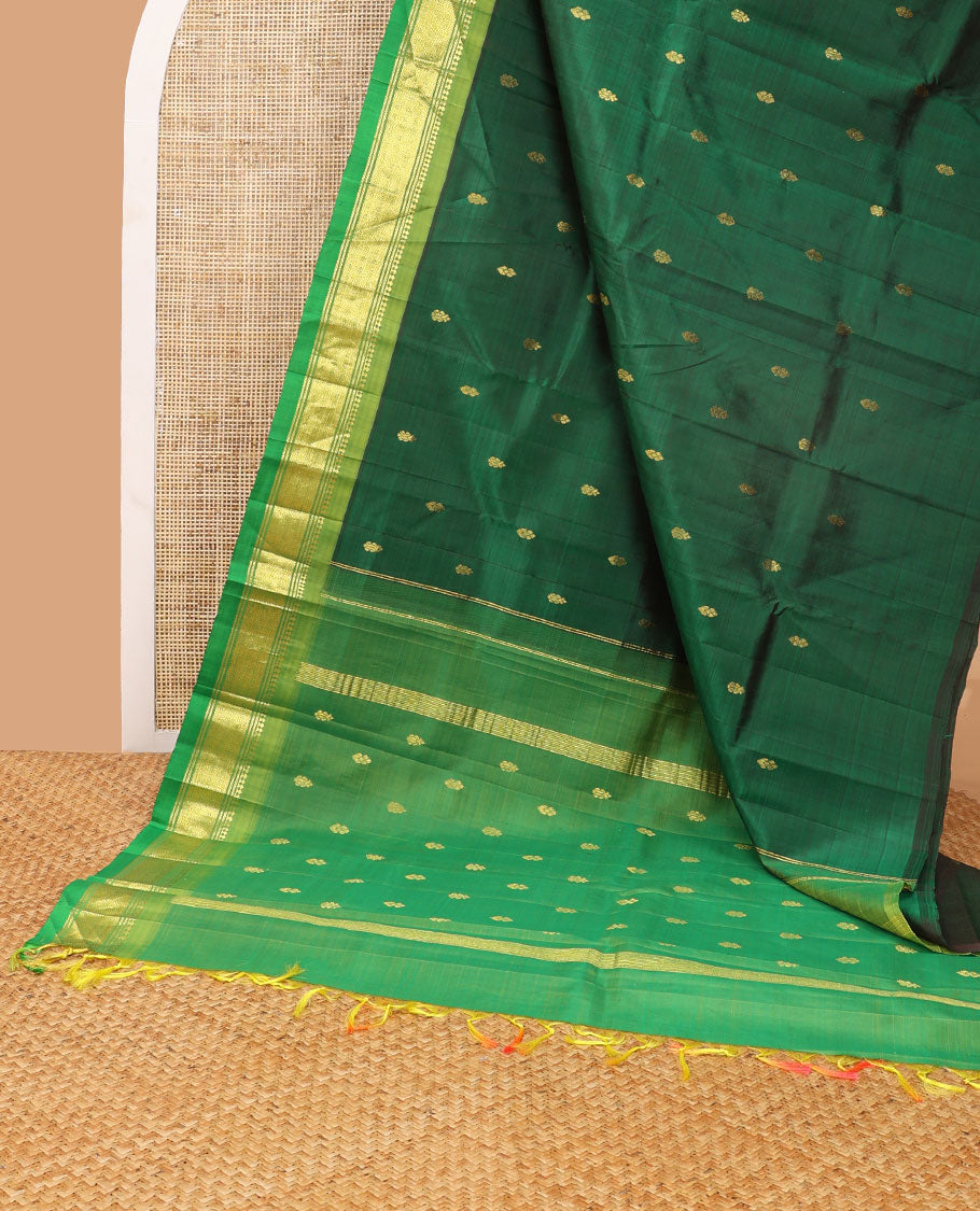 Dark green buttas kancheepuram silk saree with contrast border of thilakam mooku, banaras, muthu design & zari design pallu