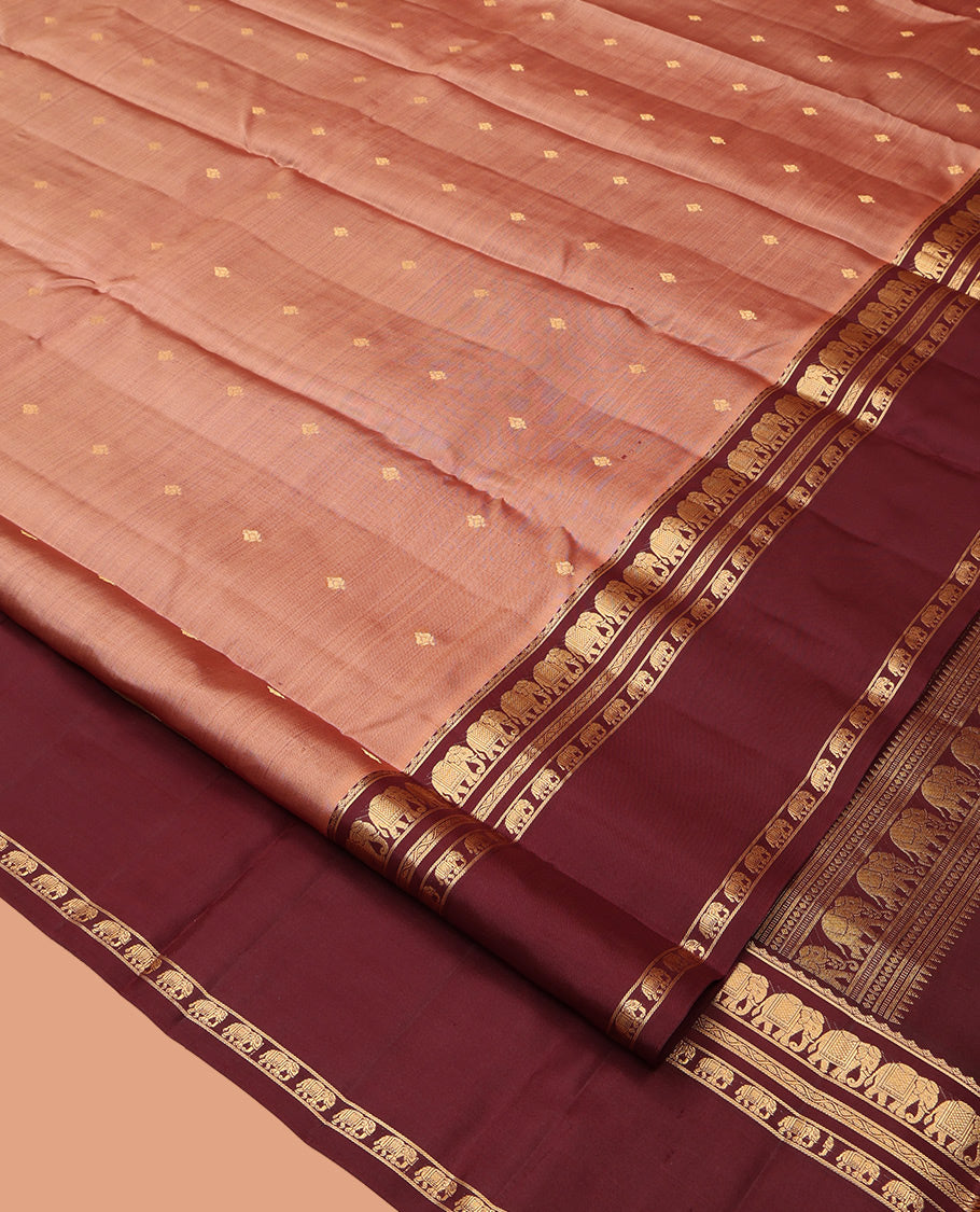 Peach Vasundhara Silk Saree, Adorned with Zari Buttas All Over Its Body, Complemented by a Contrast Rettai Pettu Border of Yaanai Designs, Grand Jaal Pallu, and Paired with a Contrast Blouse