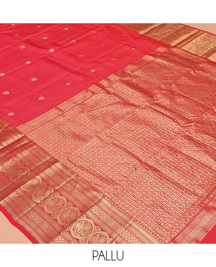 Red Vasundhara Silk Saree, Enriched with Zari Buttas and Checks All Over Its Body, Highlighted by Zari Border of Rekku, Mayil Kann, Vanki, Then Kuli Kann, and Round Mayil Designs, Grand Pallu of Butta Enclosed Checks, and Paired with a Matching Blouse