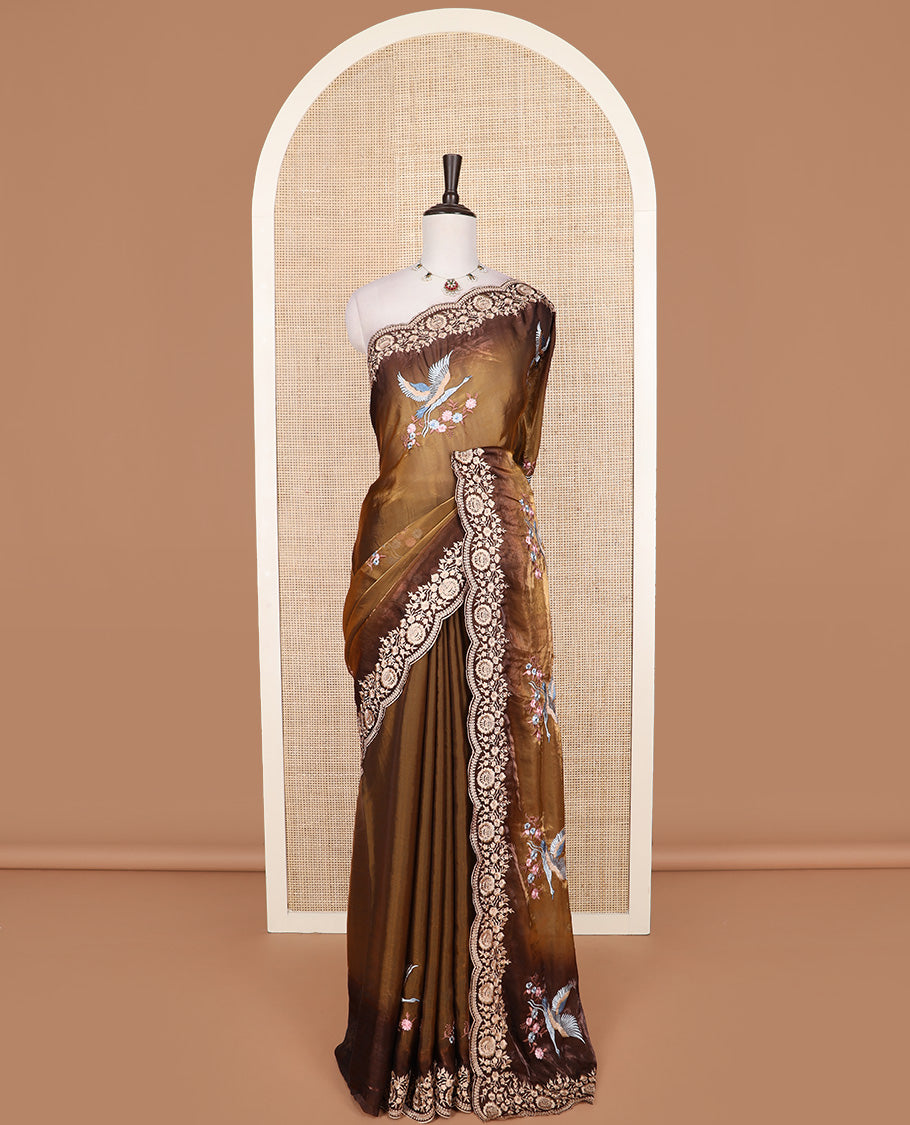 Brown crane and floral motifs thread embroidered designer saree, scallop floral thread embroidered border, and embroidered pallu