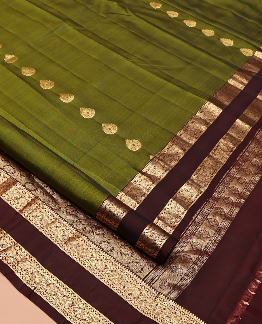 Green Mayuri Lite Silk Mix Saree, Ornamented with Zari Buttas All Over Its Body, Complemented by Contrast Zari Rettai Pettu Traditional Border, Floral Jaal Pallu, and Paired with a Contrast Blouse
