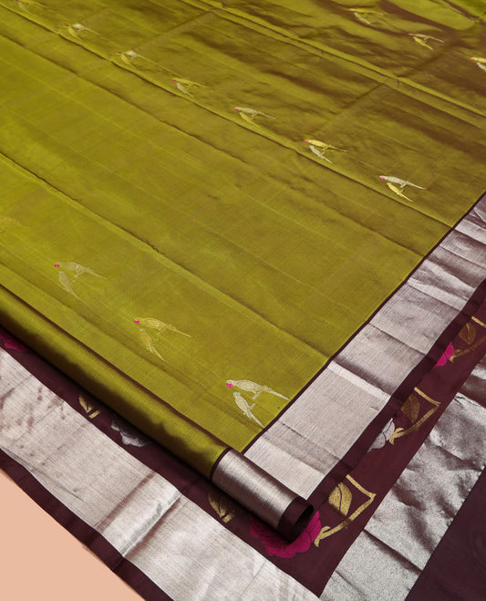Green Venkatagiri Silk Saree, Mesmerized with Parrot Green All Over Its Body, Complemented by a Contrast Zari Border, Pallu Artfully Detailed with Rose Meenakari Designs, and Paired with a Matching Blouse
