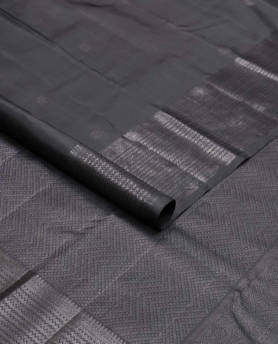 Black buttas kancheepuram silk saree with self border of thilakam mokku, muthu, banaras design & zari design pallu