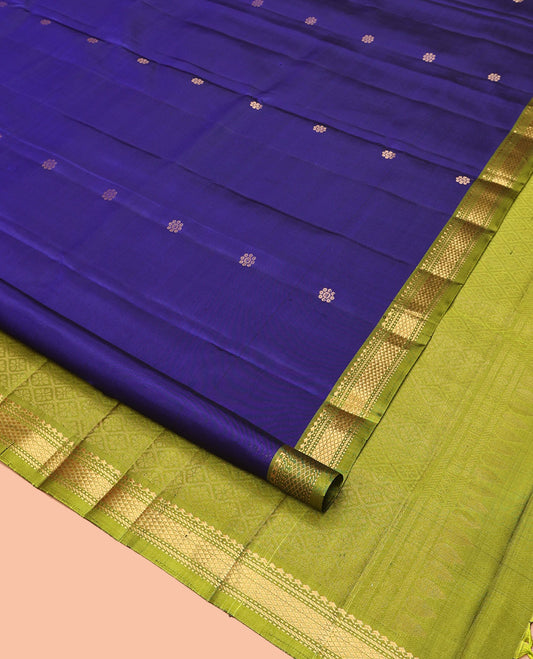 Blue Mayuri Soft Silk Saree, Spotlighted with Zari Buttas All Over Its Body, Complemented by Contrast Border of Salngai, Muthu, Banaras, and Kuyil Kann Designs, Grand Jaal Pallu and Paired with a Contrast Blouse