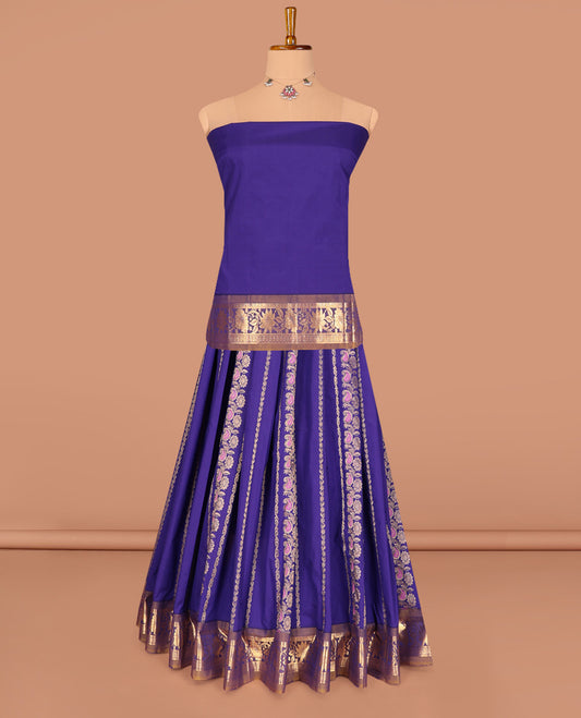 Violet Art Silk Pavadai Material Set, Graced with Zari Designs on Its Skirt, Complemented by a Contrast Floral Zari Border, and a Matching Blouse