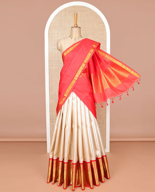 Baby pink geometric design silk half saree with contrast border of thilakam mokku, paunm mayil, yanaai design,zari design blouse & zari design border dhavani