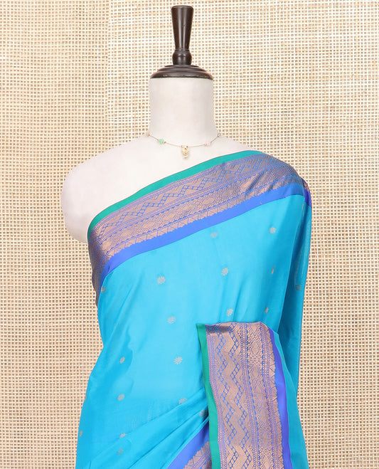 Blue Gadwal Saree Embellished with Zari Buttas, Featuring a Contrast Traditional Motifs Woven Border, Jaal Design Pallu, Along with a Complementing Contrast Zari Bordered Blouse