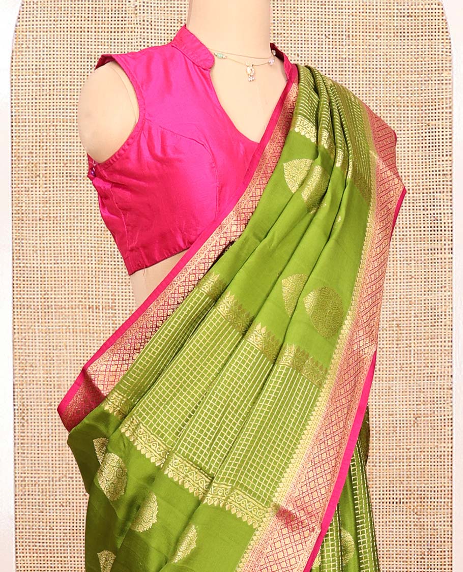 Green Mysore Silk Saree, Richly Detailed with Zari Buttas All Over Its Body, Complemented by a Contrast Traditional Zari Design Border, Pallu Steeped with Zari Stripes, and Paired with a Contrast Blouse