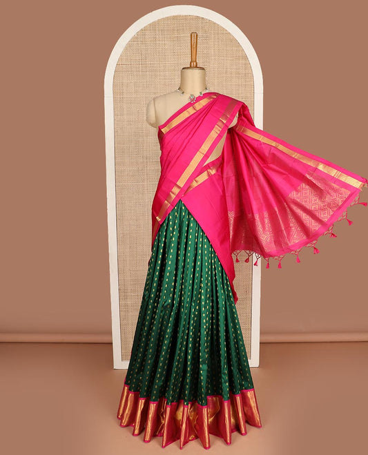 Green pure silk half saree, zari buttas skirt, contrast korvai border of rekku, muthu, laddu kamalam, kuyil kann, and zari designs and jaal pallu