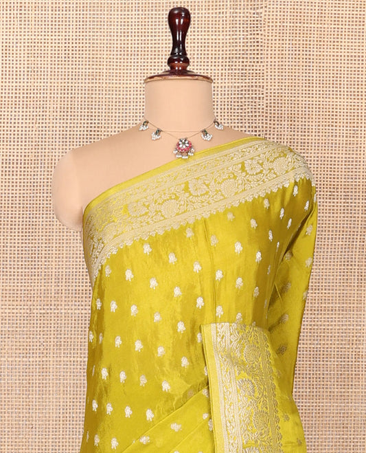Green Fancy Crepe Saree, Finely Crafted with Buttas, Highlighted by a Floral Creeper Border, Intricately Designed Pallu, and a Matching Blouse