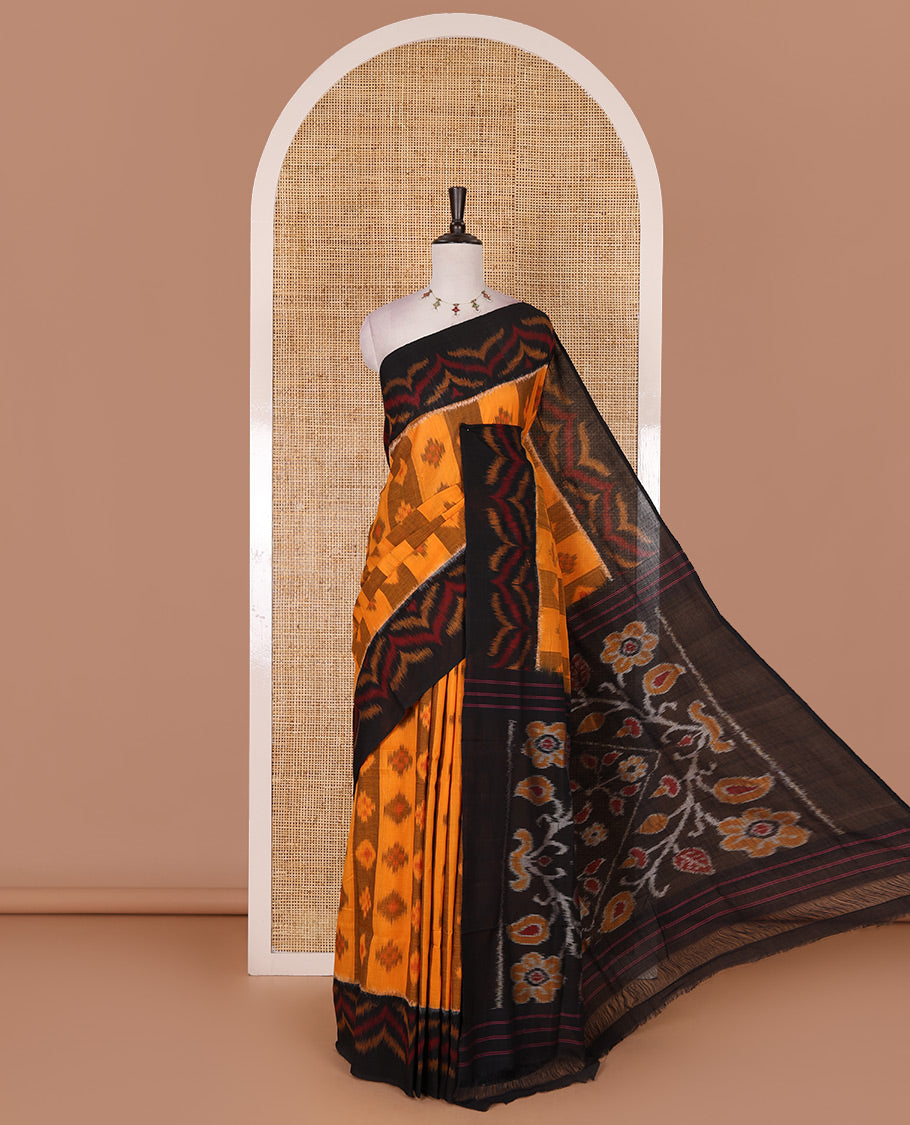 Mustard ikkat weaving ikkat cotton saree, contrast chevron design border, floral ikkat design pallu, and contrast plain blouse