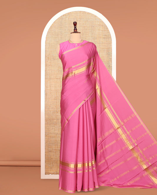 Pink Plain Mysore Silk Saree, Highlighted by Traditional Zari Border of Elephant Motifs, Subtly Zari Striped Pallu, and Paired with a Matching Blouse