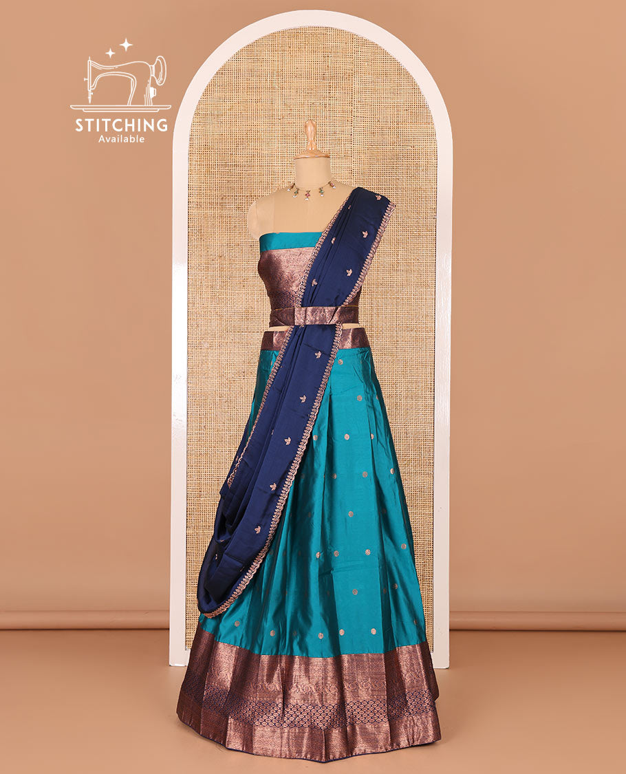Rama green taffeta silk half-saree, flower zari buttas and contrast traditional zari bordered skirt, a matching blouse, and contrast embroidered satin georgette scallop dhavani
