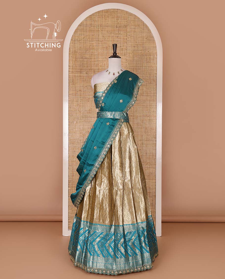 Gold banaras half saree, ogee skirt, contrast rama blue traditional zari border, matching blouse, and Syska georgette embroidered dhavani