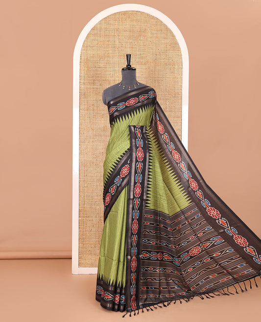 Olive green plain Katan silk saree, contrast temple ikkat floral printed border, ikkat floral printed pallu, and ikkat printed blouse