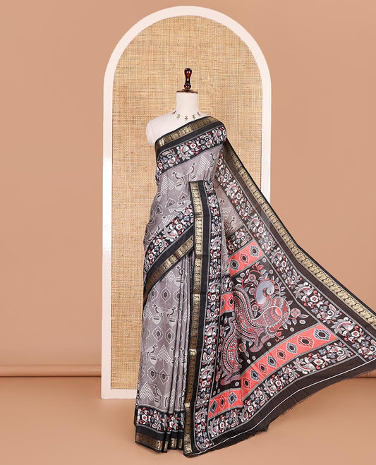 Grey pochampally ikkat parrot motifs printed dola silk saree, contrast border of kalamkari printed with zari work, kalamkari peacock printed pallu, and contrast zari design blouse
