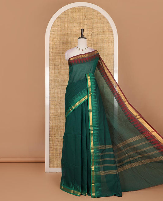 Green plain Chettinad cotton saree, contrast ganga jamuna temple zari border, striped pallu, and plain blouse