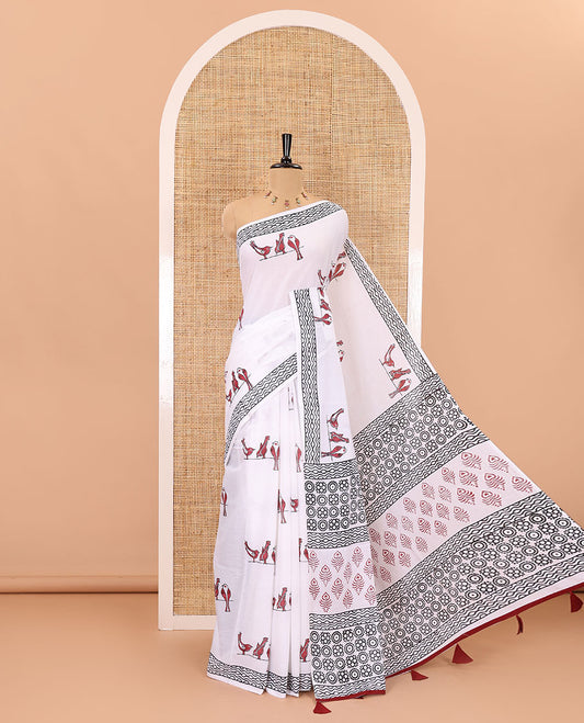 White sparrow motifs hand block printed soft mul cotton, block printed geometric border, intricate motifs printed pallu, and a contrast plain blouse