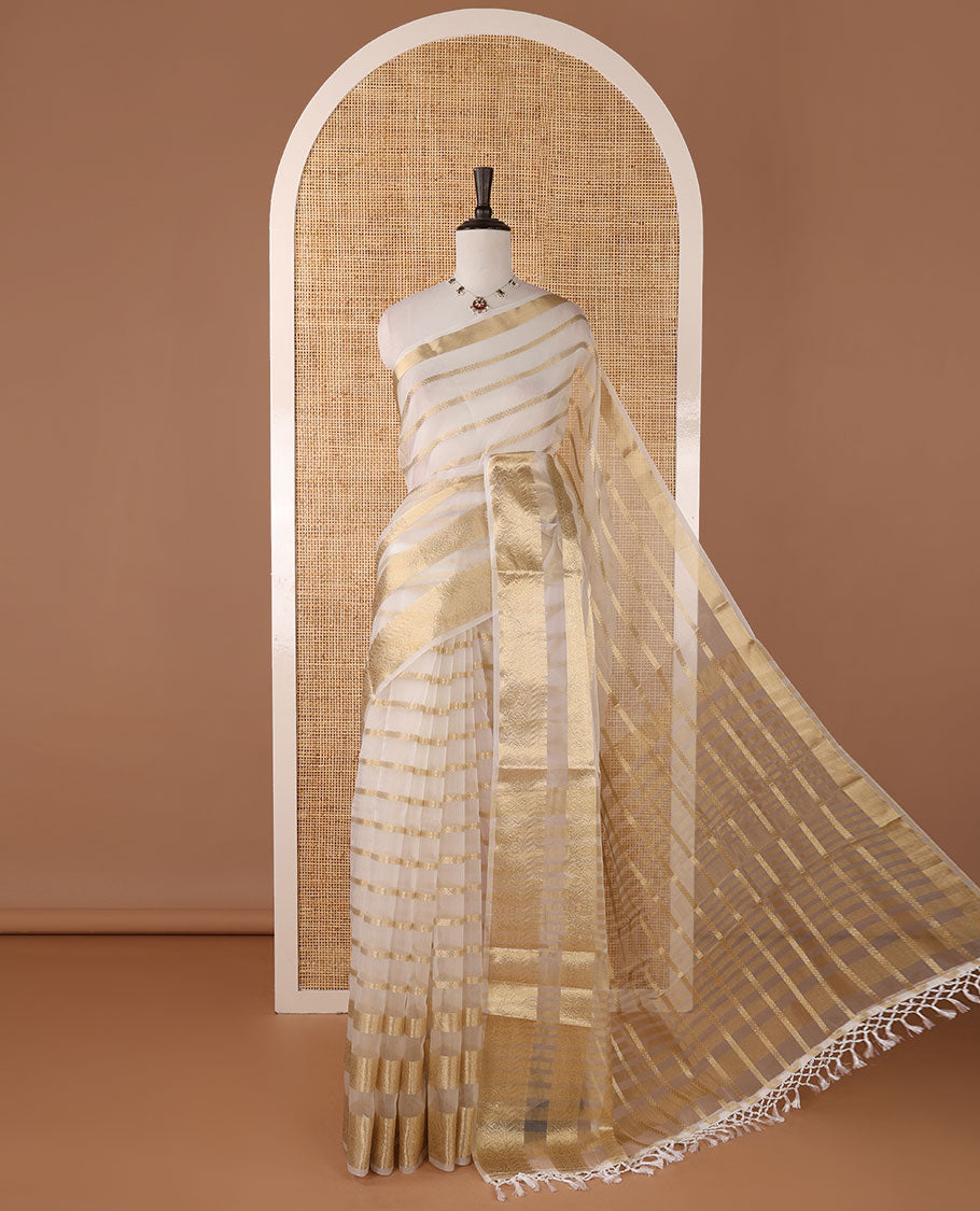 Half-white veldhari zari design semi-organza saree, gold zari floral creeper border, zari design pallu & blouse